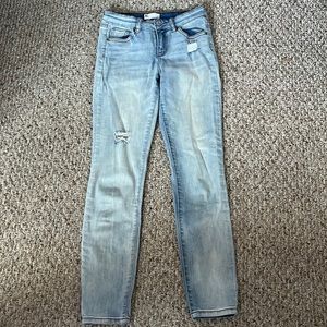 light blue mid rise skinny girls jeans